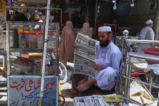 Newspaper with front-page story about military tensions